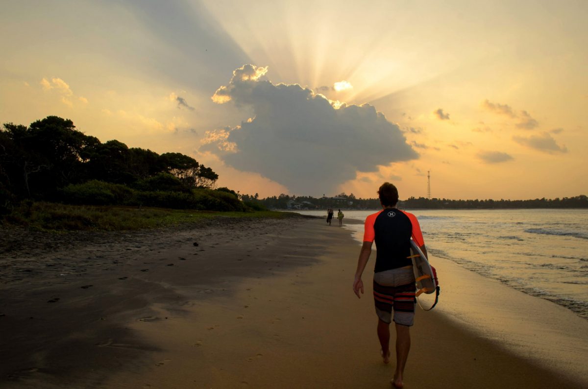 Sri Lanka Arugam Bay surfer at sunset